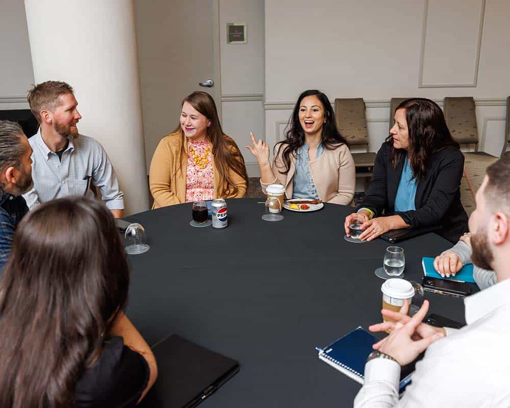 Collaborative table discussion at the Contract Administration Conference